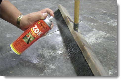 A spray that acts like a magnet attracting dust and lint into brooms, mops and cloths